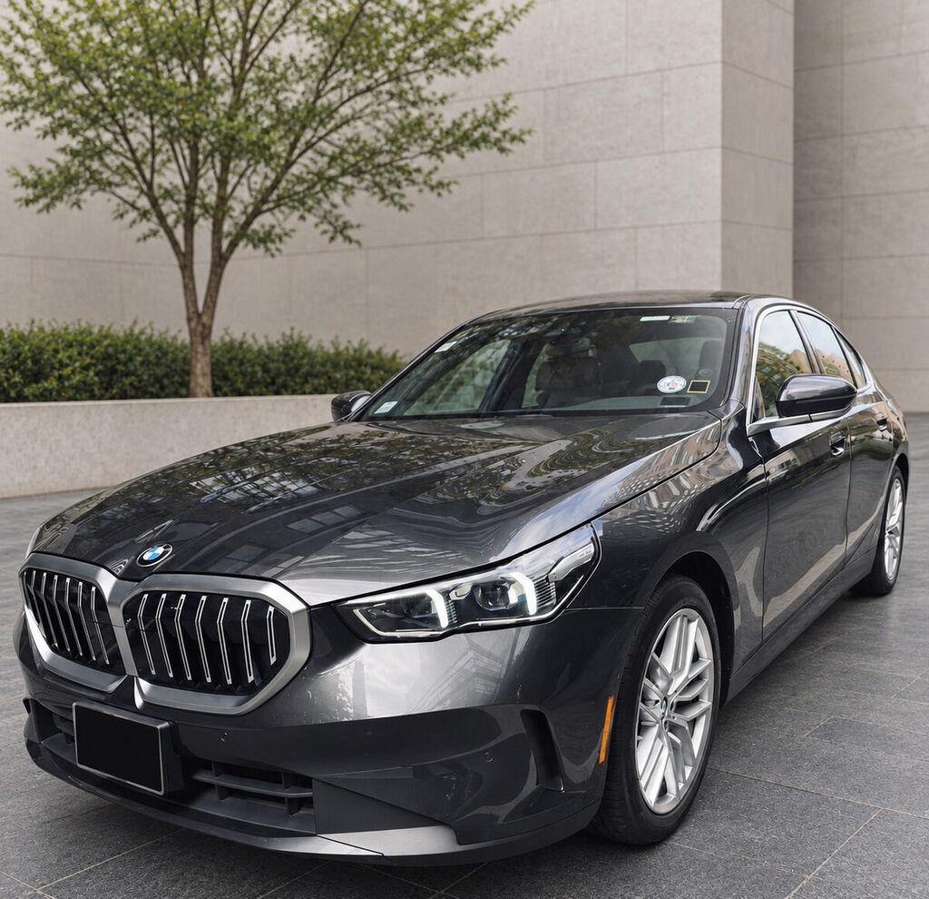BMW 5 Series front exterior with the license plate concealed