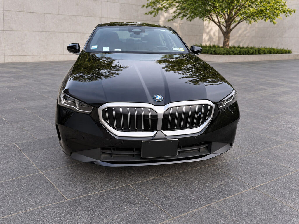 BMW i5 front exterior with plate concealed