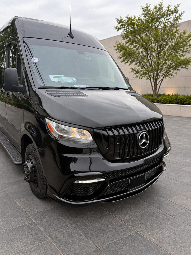 Black Mercedes-Benz Sprinter front exterior with plate concealed